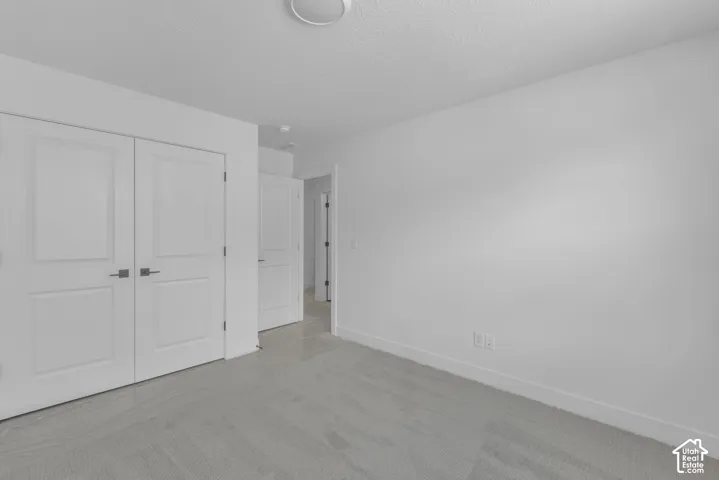 Large oversized secondary bedroom with double door closet.