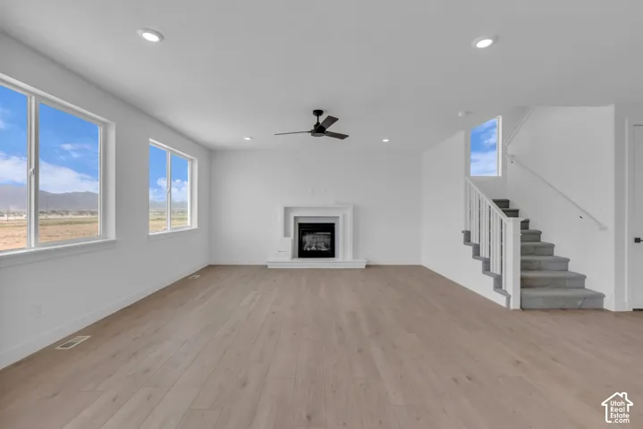 Great room with large windows and exquisite mountain views.  Gas fireplace in large gathering room.