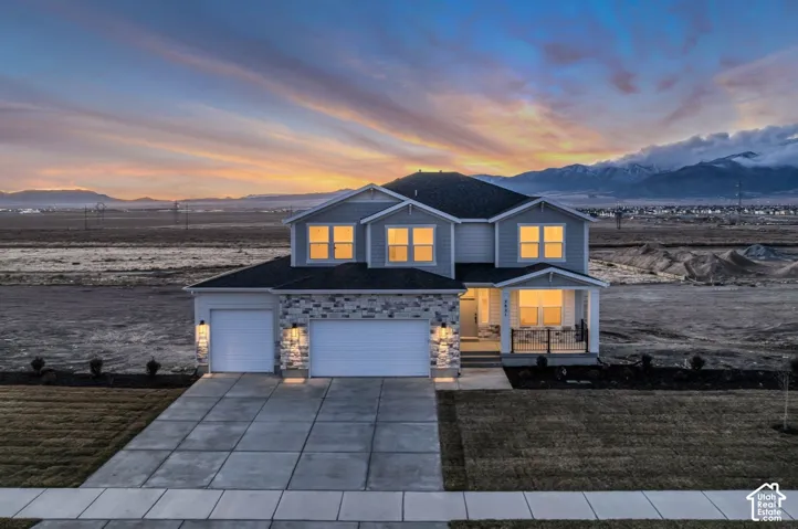 View of home from the east showing incredible mountain views at sunset.