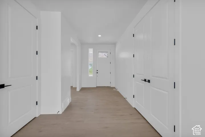 Spacious entry foyer with sidelight and 8' entry door with transom glass.