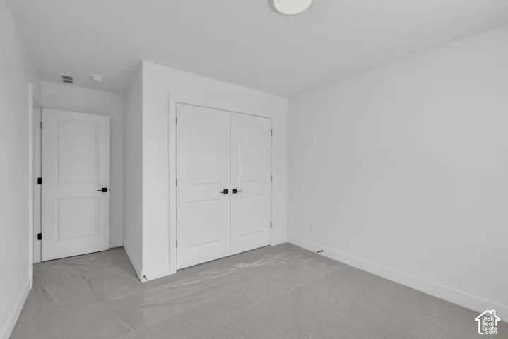 Large oversized secondary bedroom with double door closet.