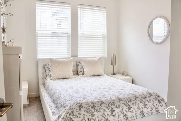 Recessed lighting, wall-to-wall carpeting, and bright white walls