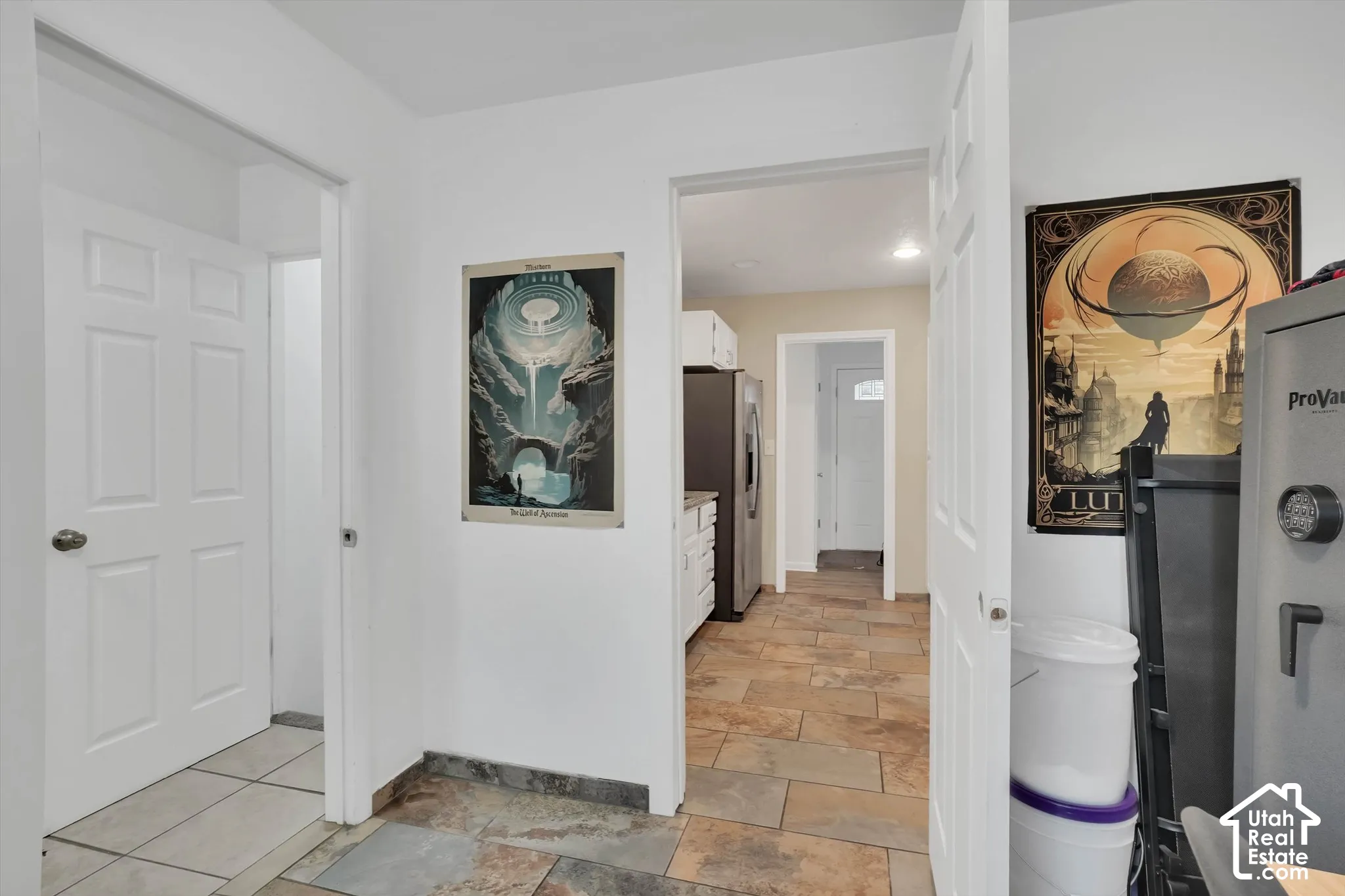 White interior doors, recessed lighting, and stone-finish flooring