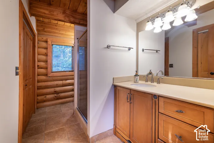 Spacious vanity with light-colored countertop and integrated sink
