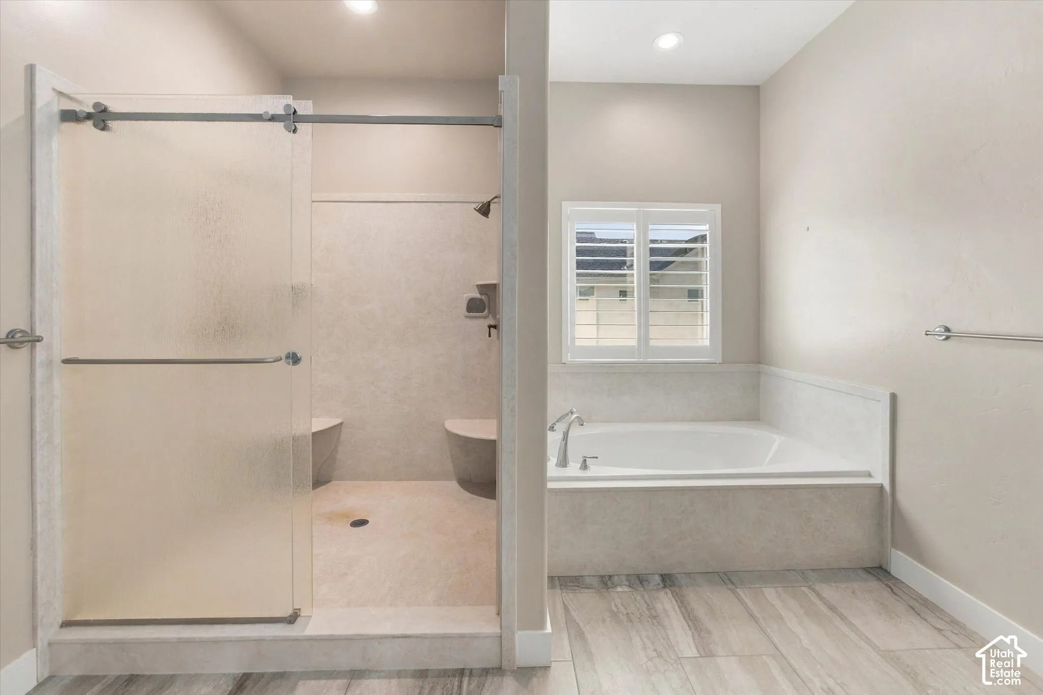 Master Ensuite featuring a built-in soaking tub, a walk-in shower