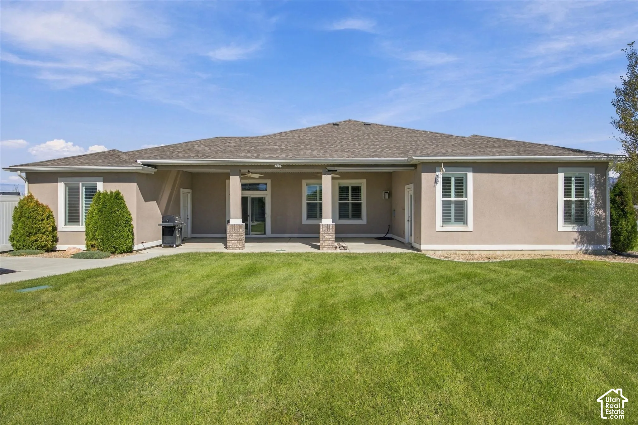 Back of this Beautiful home with covered patio.