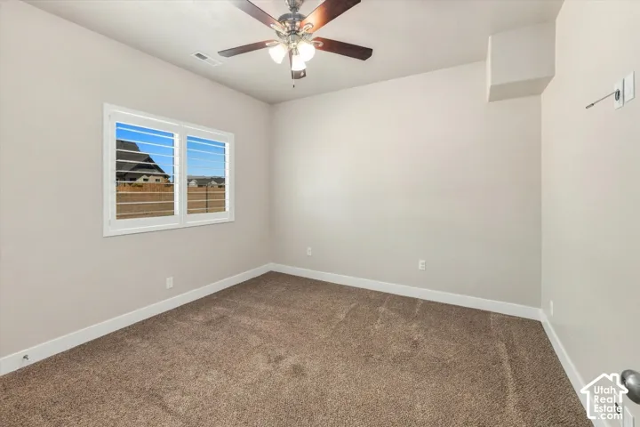 Neutral-toned wall paint and brown carpeting