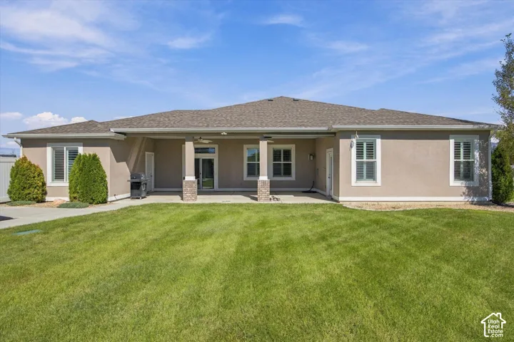 Back of this Beautiful home with covered patio.