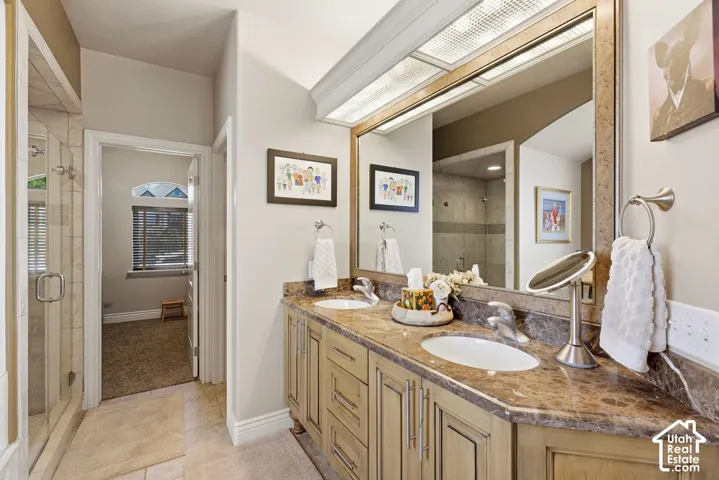 Spa-style ensuite featuring double vanity, oversized jetted tub and separate shower