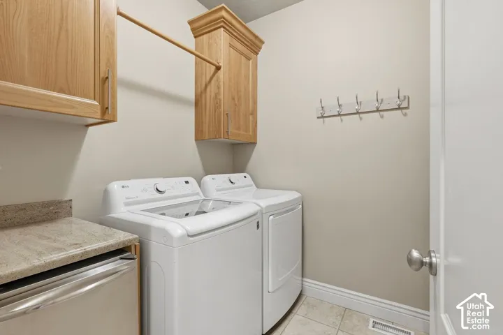 Laundry room on the main floor with a counter for folding and lots of storage
