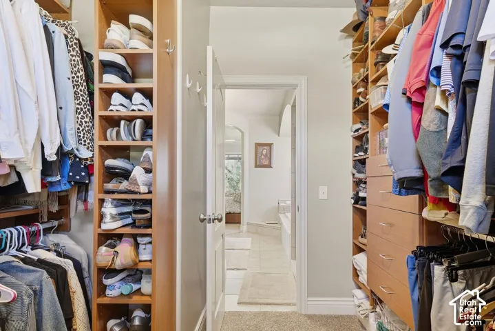 Primary bedroom walk in closet