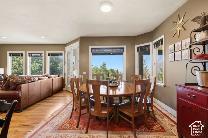 Sunny dining room right off the kitchen with tons of natural light and access to the cover deck