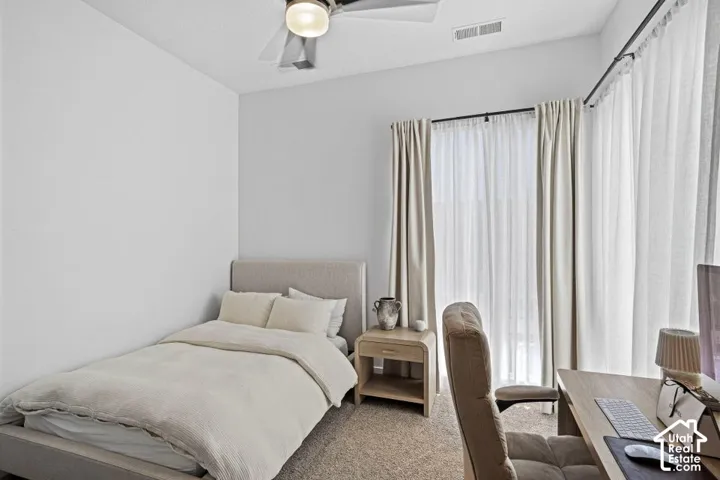 Recessed lighting, ceiling fan, and carpeted flooring