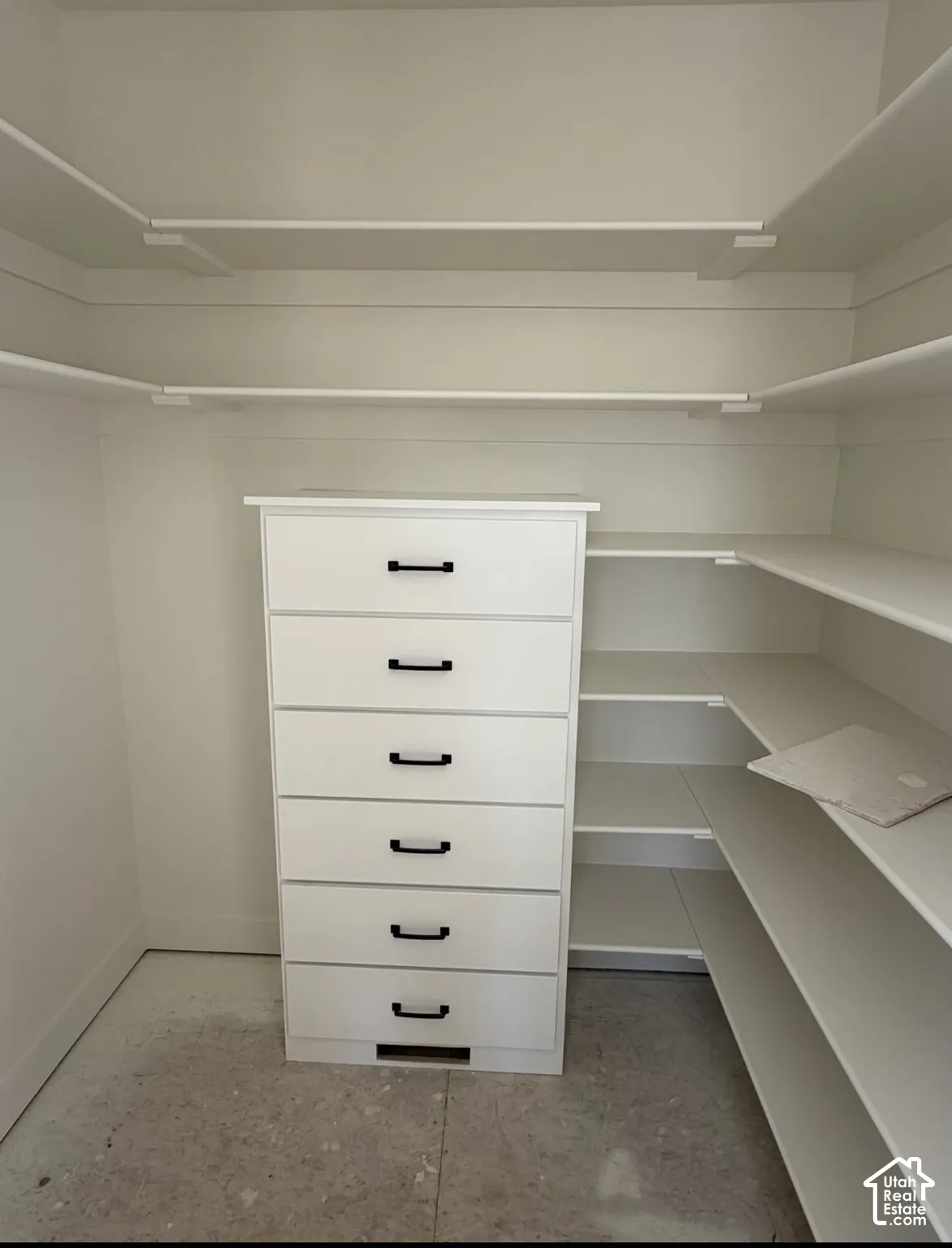 Built-in shelving and drawer unit with matte black hardware
