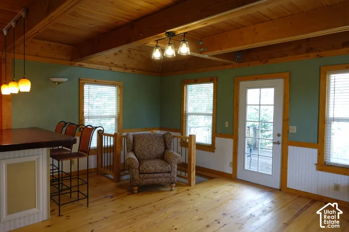 Wood flooring with exposed wood beam ceiling