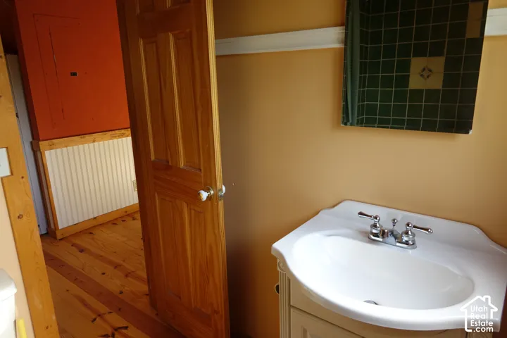 White porcelain basin with a dual-handle chrome faucet