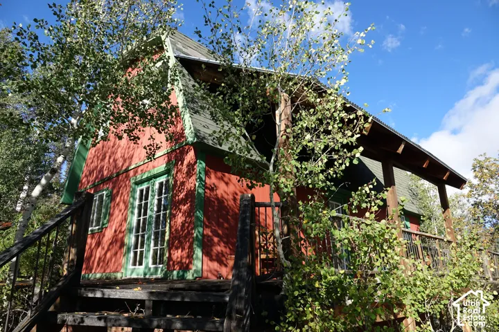 Red exterior siding with green trim accents