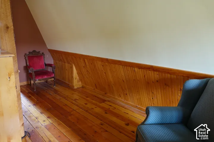 Wood flooring with horizontal wood-paneled walls