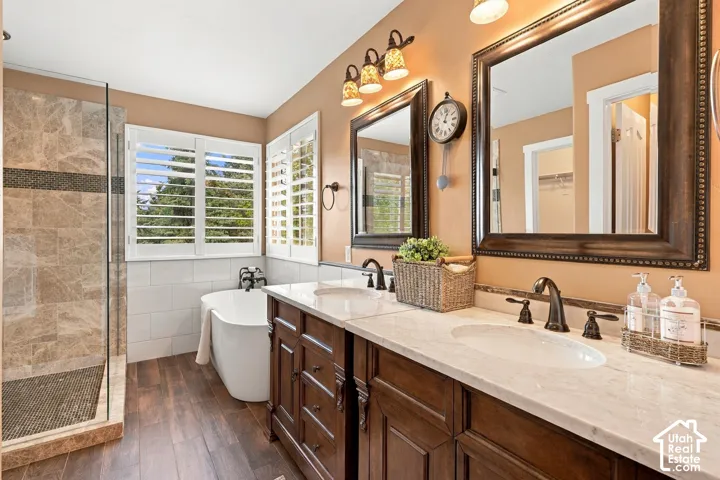 Dual vanity with stone countertops and bronze-finish fixtures