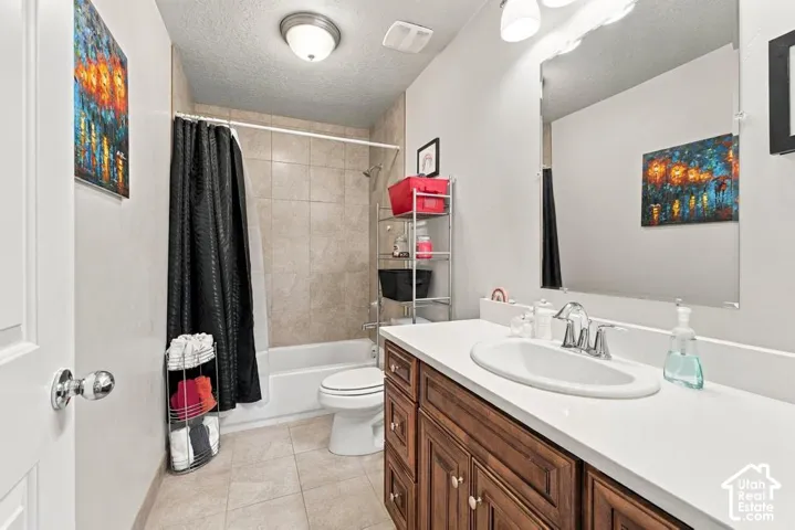Wood-finish vanity with an integrated sink and chrome fixtures