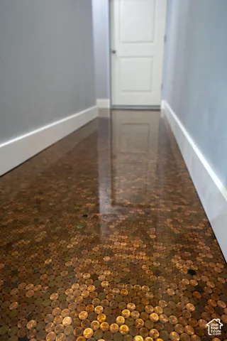 Custom penny-tiled flooring with a high-gloss finish