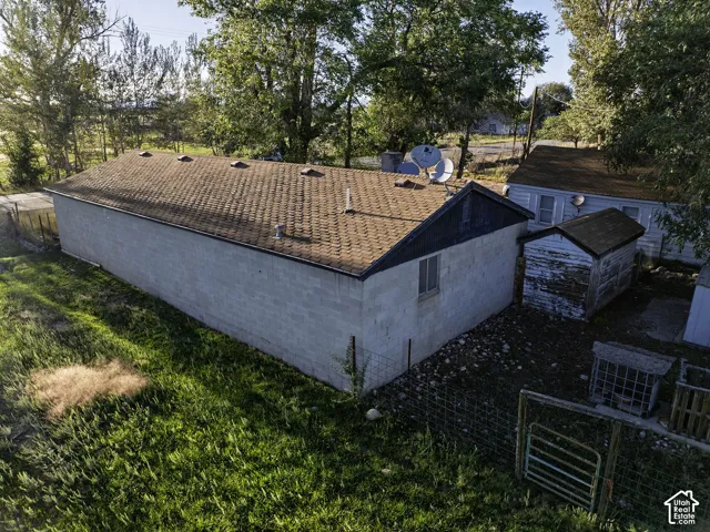 Block construction building with a shingle roof