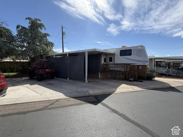 Concrete driveway with an attached carport