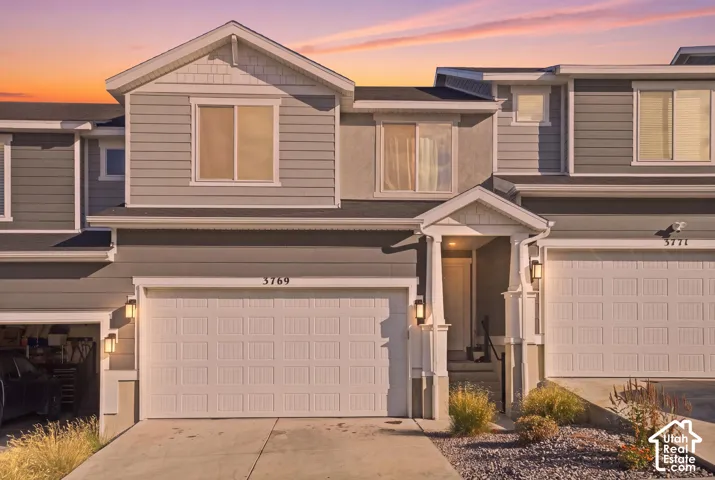 Multi-story facade featuring horizontal siding and shingle accents