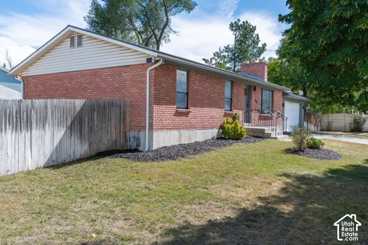 Red brick exterior with white siding accents
