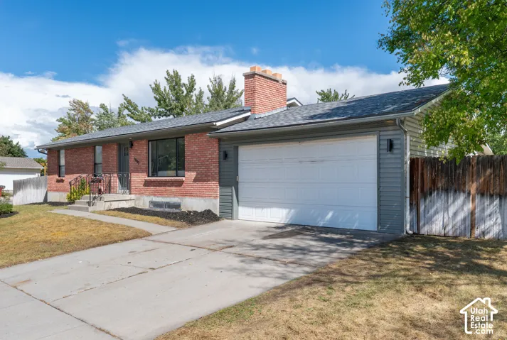 Brick and siding exterior with a shingled roof