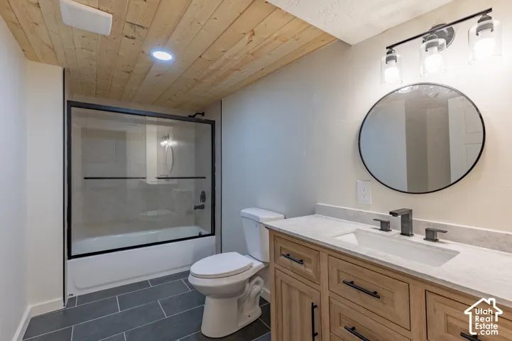 Wood plank ceiling with recessed lighting