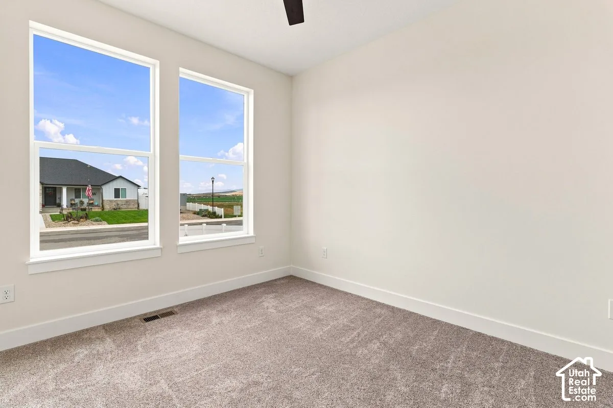 Soft pile carpeting, neutral wall paint, and dual pane windows