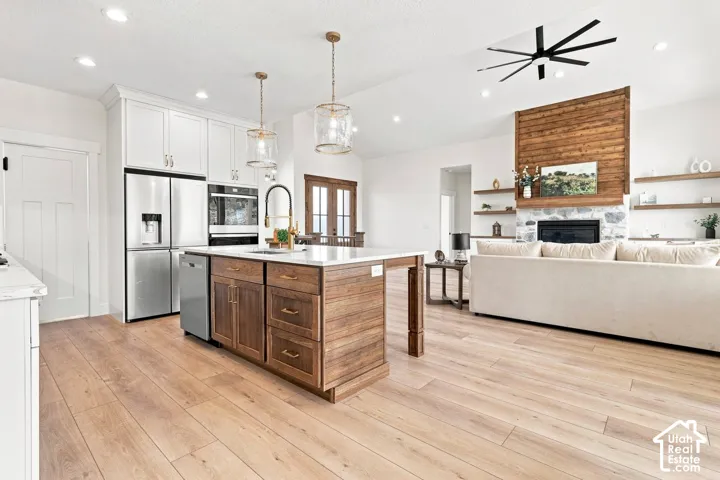 Spacious open-concept layout with wood-finish flooring