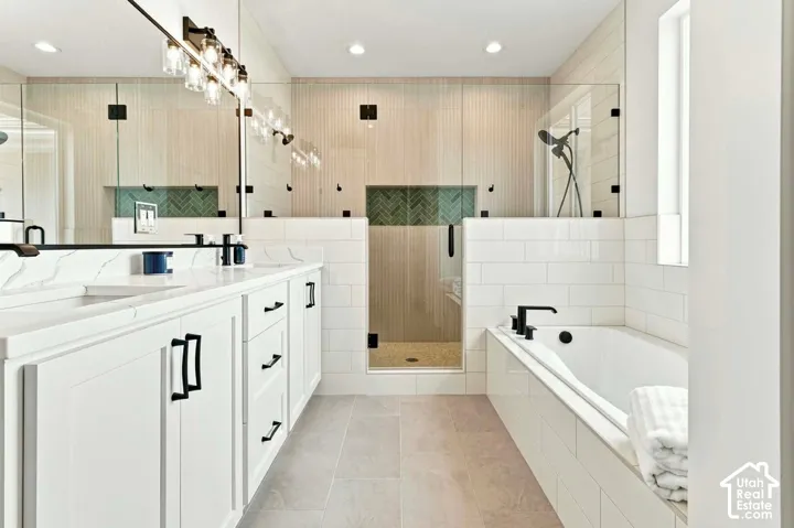Dual vanity with undermount sinks, quartz countertops, and matte black fixtures