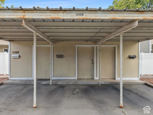 Covered parking structure with metal roofing