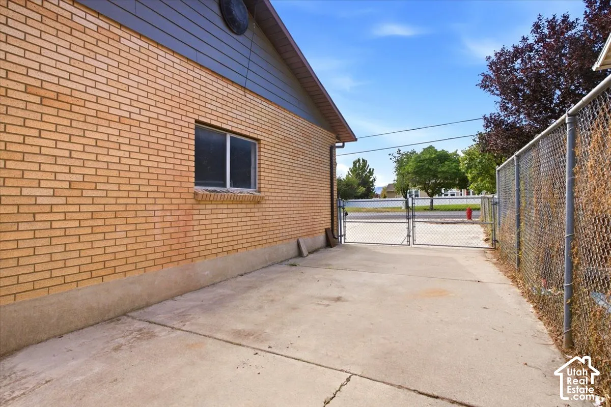 Brick exterior with a concrete foundation and a functional window
