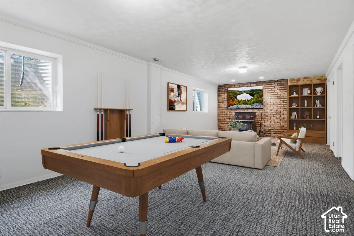 Recessed lighting illuminates a brick-clad wall, complemented by built-in shelving