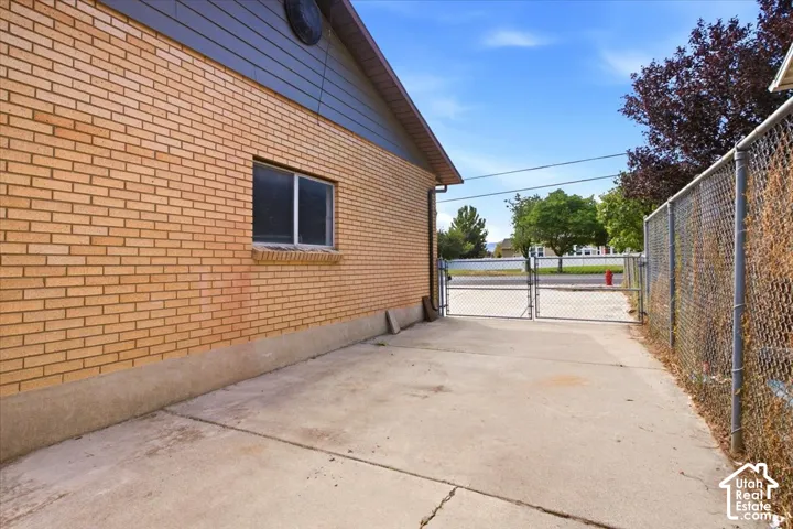 Brick exterior with a concrete foundation and a functional window