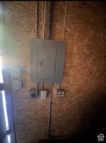 Electrical panel with multiple conduits and outlets on oriented strand board