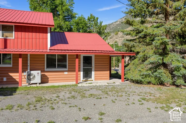 Red metal roofing complementing the horizontal siding