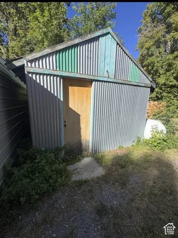 Corrugated metal exterior with a wood door