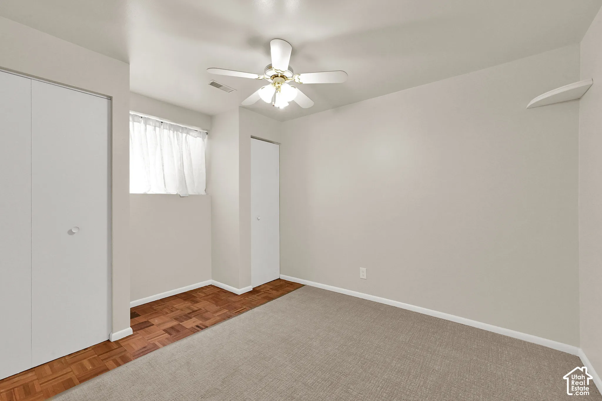 Downstairs bedroom with fresh carpet and paint