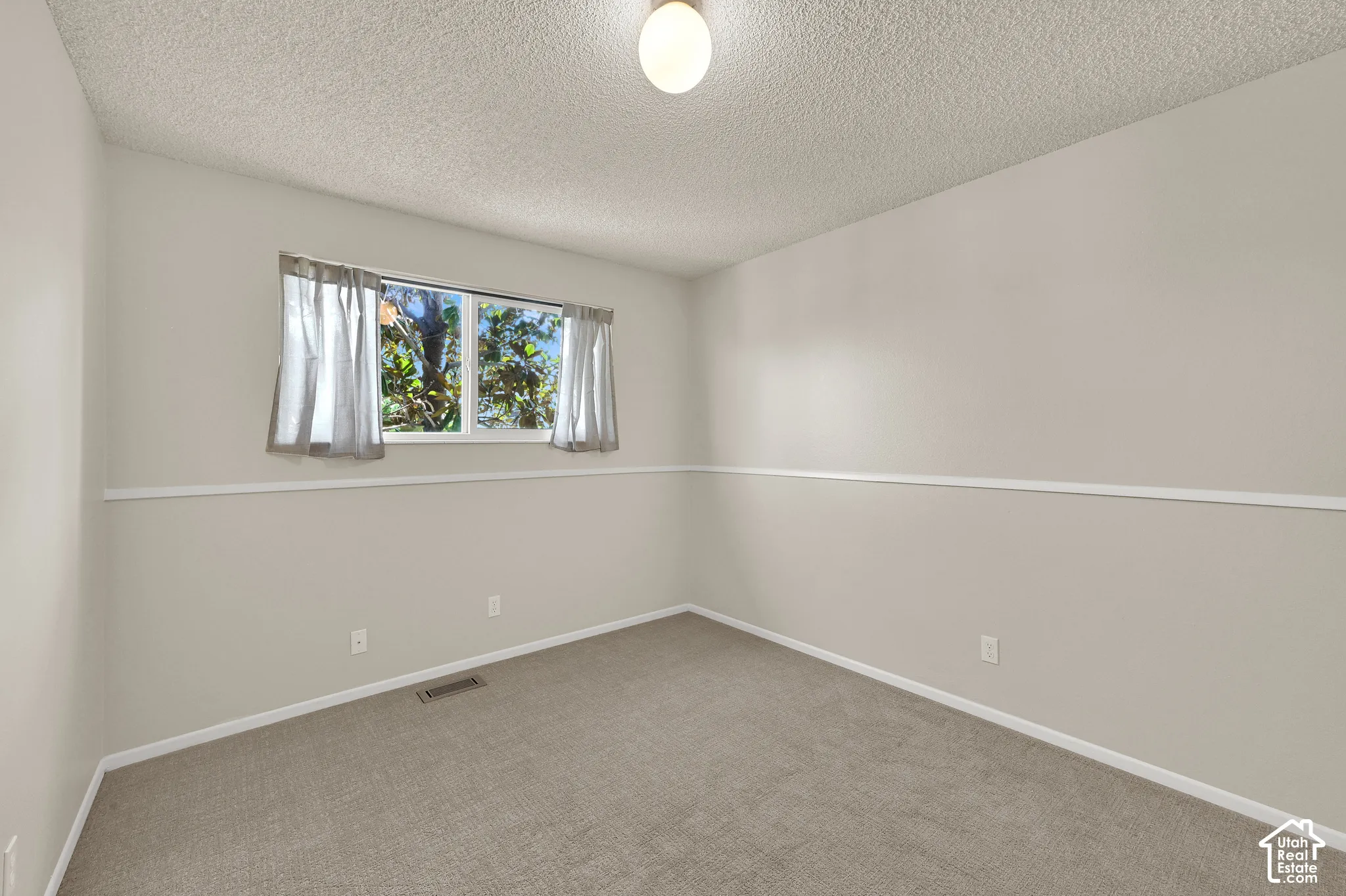 Second Bedroom with fresh paint and carpet