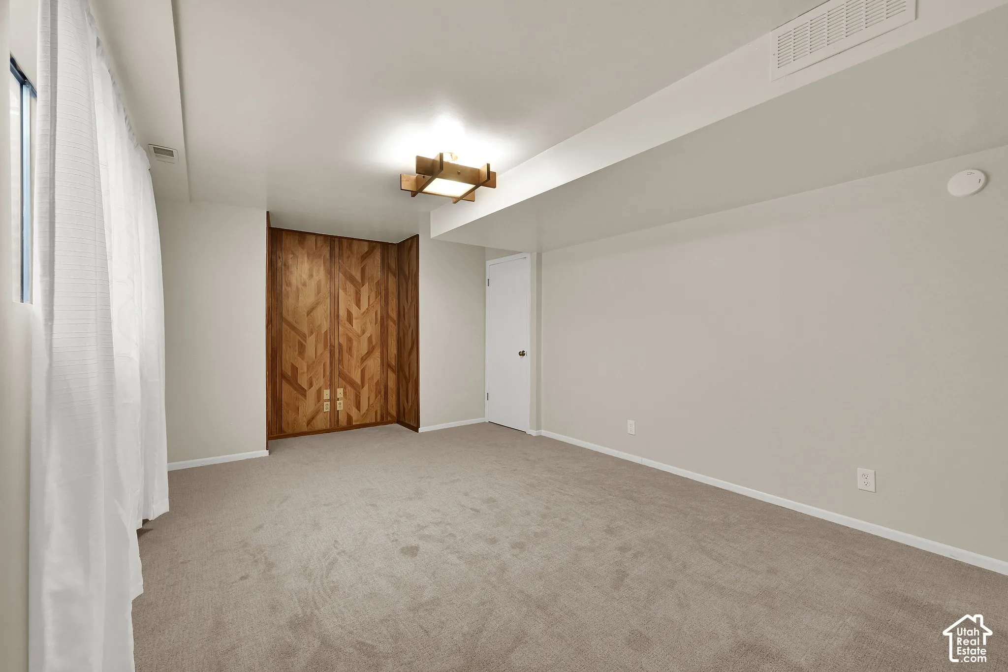 Spacious family room with fresh paint and carpet