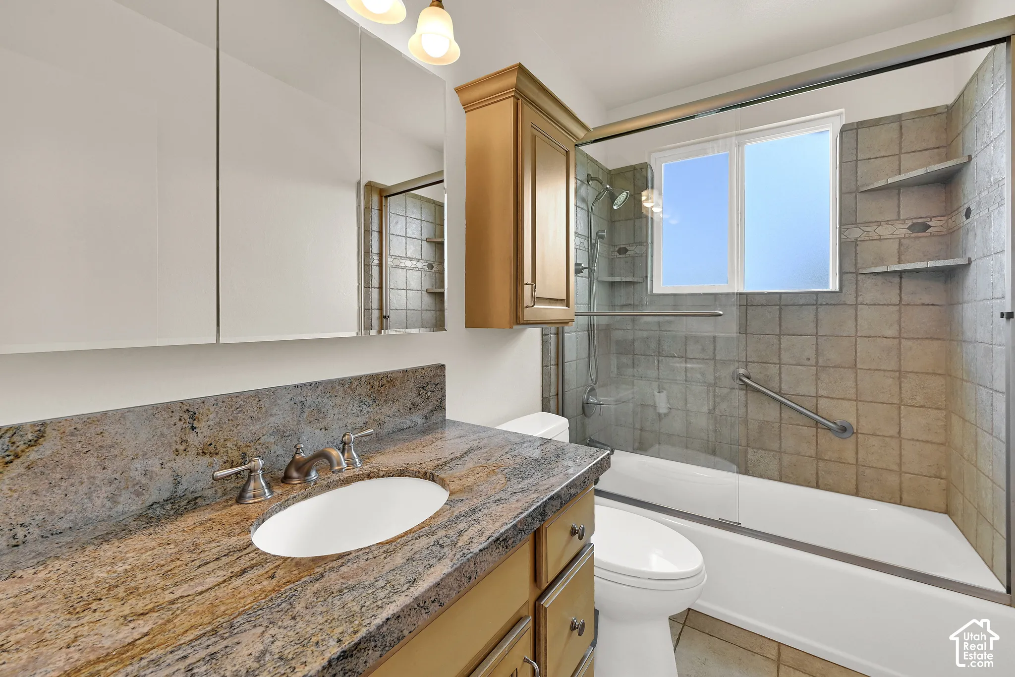 Full bathroom with granite countertop, and beautiful tile surround
