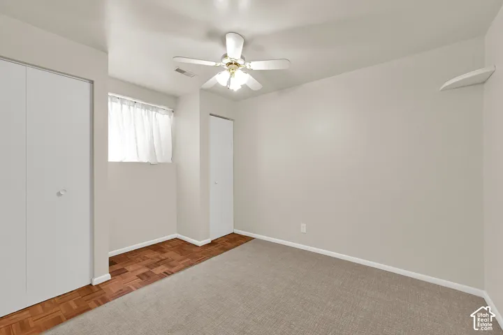 Downstairs bedroom with fresh carpet and paint