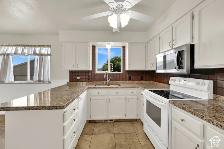 Spacious kitchen looks out to the backyard and has plenty of workspace