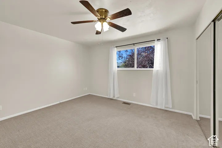 Spacious bedroom with fresh carpet and paint