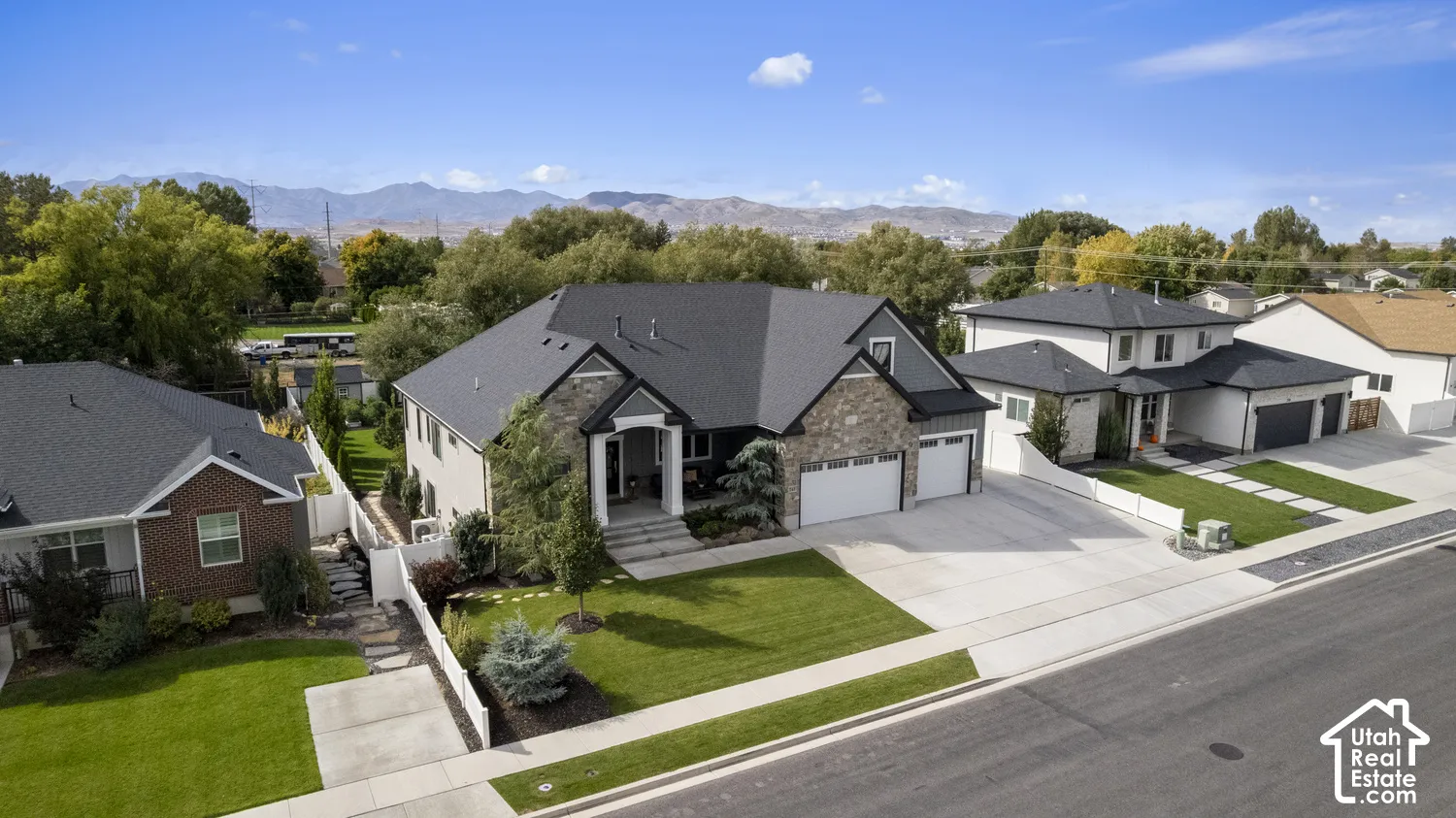 Contemporary two-story residence featuring a stone and siding facade