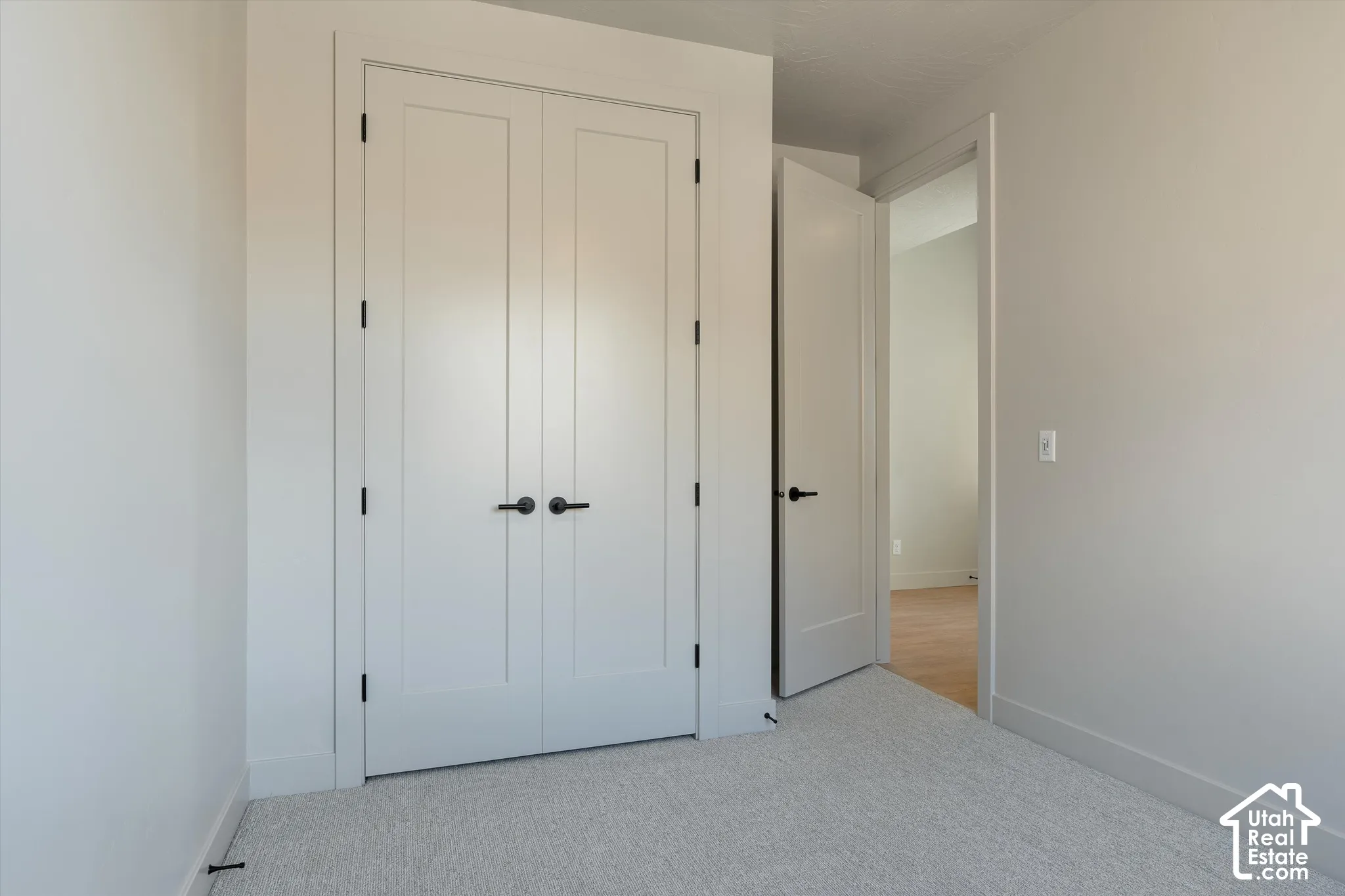 White walls with matching trim and doors